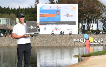 Brooks Koepka of the United States poses with his trophy after winning the CJ Cup PGA golf tournament at Nine Bridges on Jeju Island, South Korea, Sunday, Oct. 21, 2018. (Park Ji-ho/Yonhap via AP)