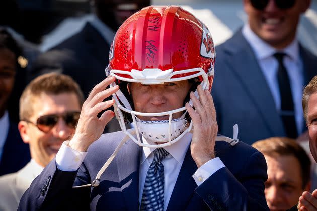 President Joe Biden briefly donned a Chiefs helmet at Friday's celebratory gathering.