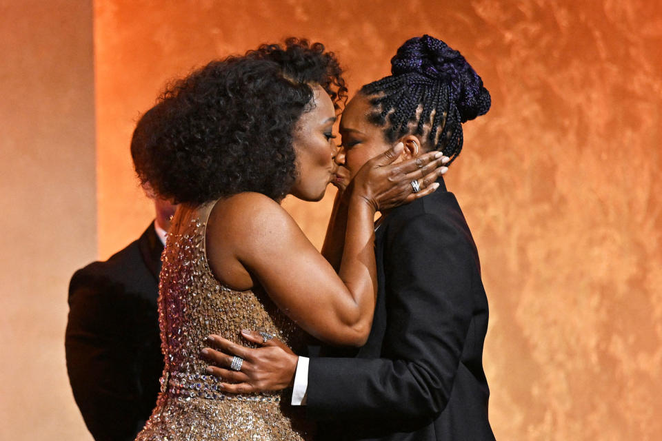 Angela Bassett kisses Regina King (Robyn Beck / AFP via Getty Images)