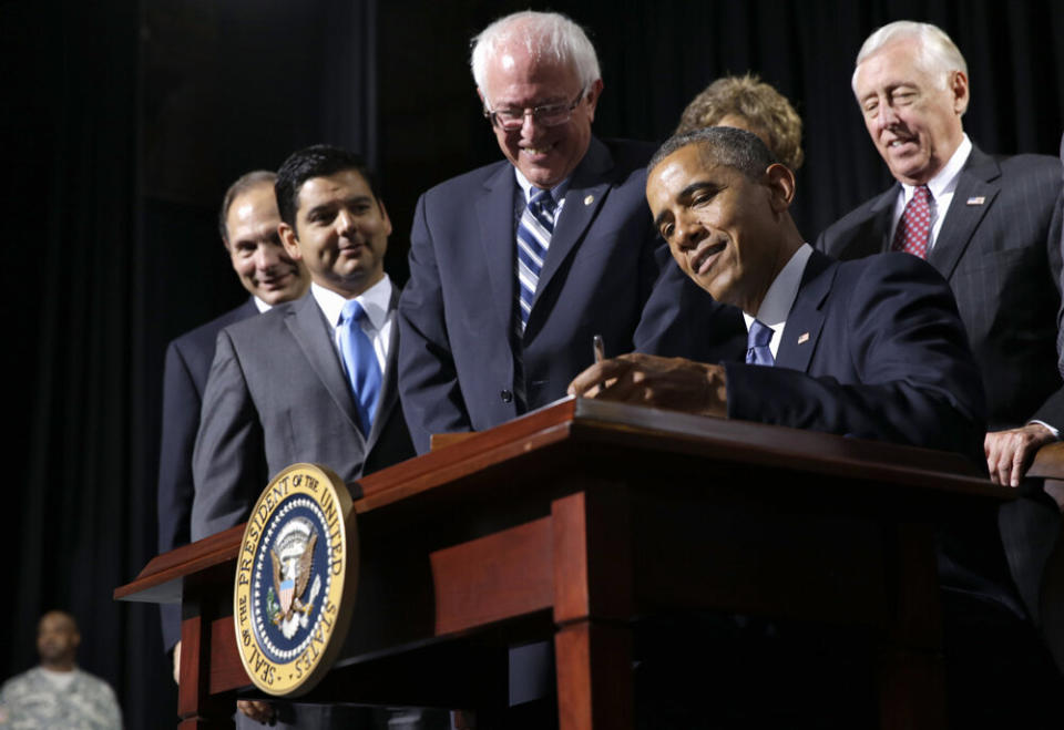 Former President Barack Obama in 2014 signing into law the "VA Choice" bill that President Donald Trump falsely claims he brought into being. (Photo: ASSOCIATED PRESS)