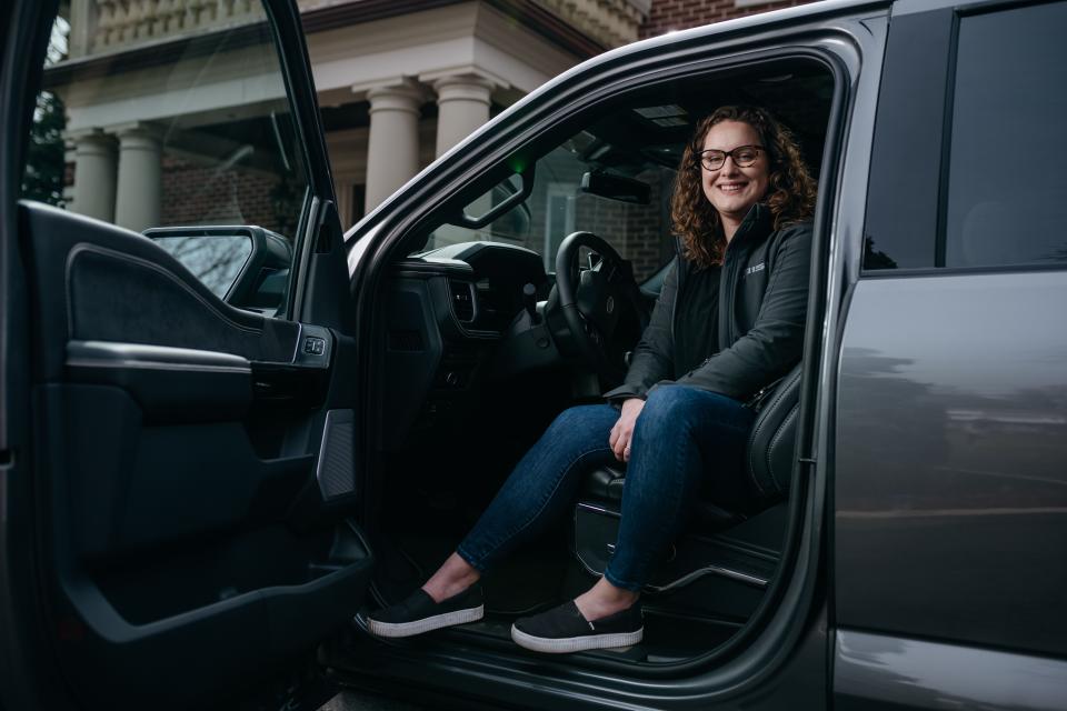 Megan Gegesky, program management launch supervisor for the all-electric Ford F-150 Lightning, sits in the pickup truck at her home on Grosse Ile in early April.