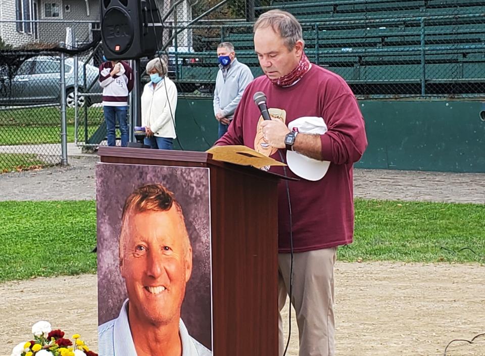 Tom Kozikowski, Rus Wilson's second in command and longtime friend tells great stories about his friend at a celebration of life event in Wilson’s honor Saturday at Leary Field. [Karen Dandurant/Seacoastonline]