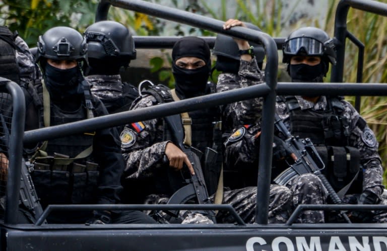 Members of the Bolivarian National Intelligence Service (SEBIN) patrol Caracas in an operation to capture Oscar Perez on Monday