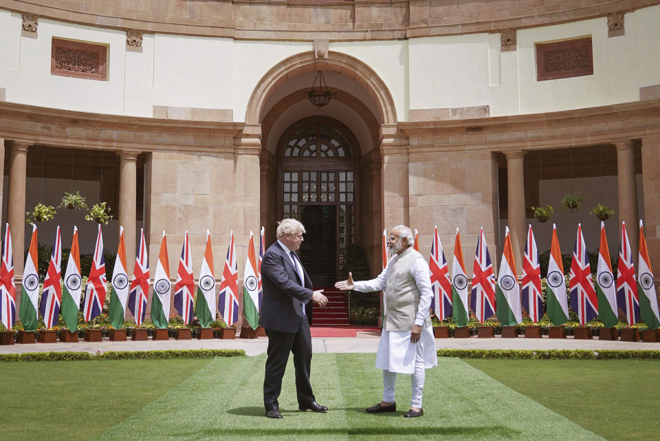 British Prime Minister Boris Johnson, left, meets Indian Prime Minister Narendra Modi at Hyderabad House in New Delhi Friday, April 22, 2022. (Stefan Rousseau/Pool Photo via AP)