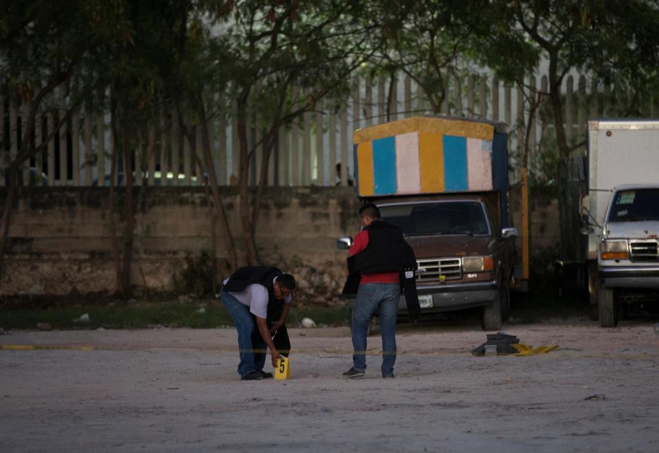 Mexico Cancun shooting police investigator forensics