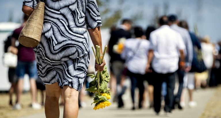 Bereaved relatives attend a memorial service at the National Monument near Amsterdam for the 298 people killed four years ago when flight MH17 was shot down over war-torn Ukraine