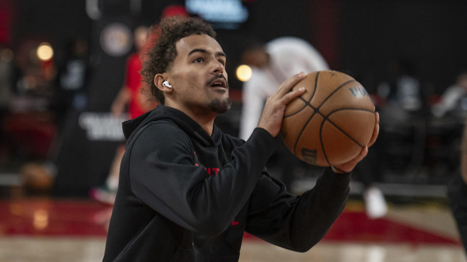 CORRECTS YEARS - Atlanta Hawks guard Trae Young (11) shoots during warm-ups before a preseason NBA basketball against the New Orleans Pelicans, Saturday, Oct. 14, 2023, in College Park, Ga. (AP Photo/Hakim Wright Sr.)