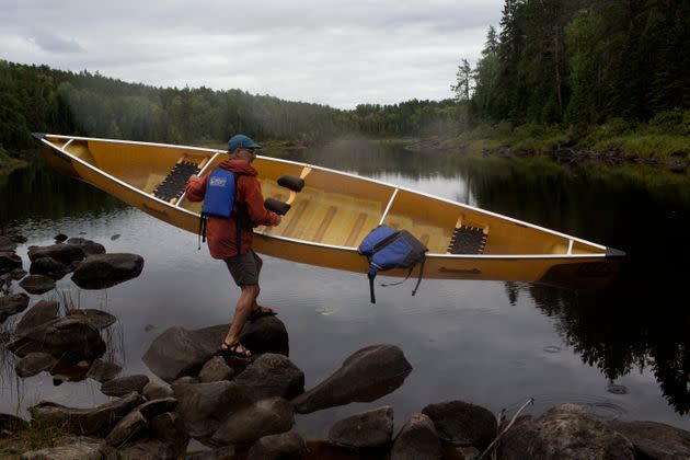 Outdoor enthusiasts travel by canoe through several of the hundreds of freshwater lakes that make up the Boundary Waters in September 2019 in the northern woods of Minnesota.  (Photo: Andrew Lichtenstein via Getty Images)