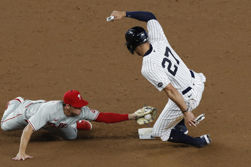 New York Yankees designated hitter Giancarlo Stanton (27) slides into second ahead of the tag by Philadelphia Phillies second baseman Scott Kingery (4) during the eighth inning of a baseball game Monday, Aug. 3, 2020, at Yankee Stadium in New York. (AP Photo/Kathy Willens)