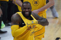 Los Angeles Lakers forward LeBron James walks onto the court for the first half of basketball's NBA All-Star Game in Atlanta, Sunday, March 7, 2021. (AP Photo/Brynn Anderson)