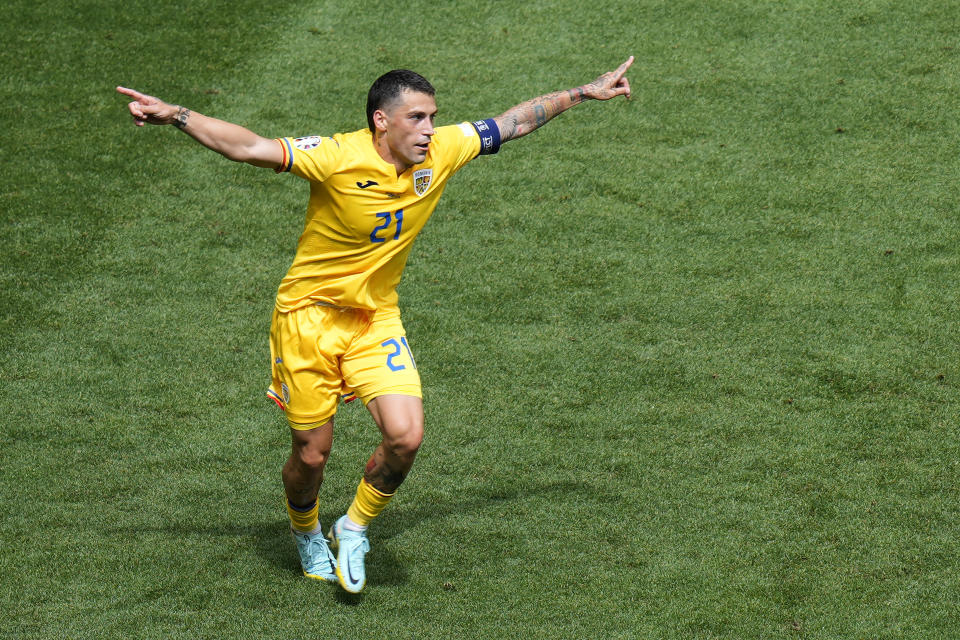 Romania's Nicolae Stanciu celebrates after scoring the opening goal against Ukraine during a Group E match between Romania and Ukraine at the Euro 2024 soccer tournament in Munich, Germany, Monday, June 17, 2024. (AP Photo/Ariel Schalit)