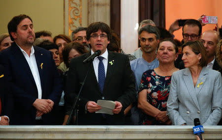 Catalan President Carles Puigdemont speaks during a ceremony after the Catalan regional Parliament declared independence from Spain in Barcelona, Spain, October 27, 2017. REUTERS/Albert Gea