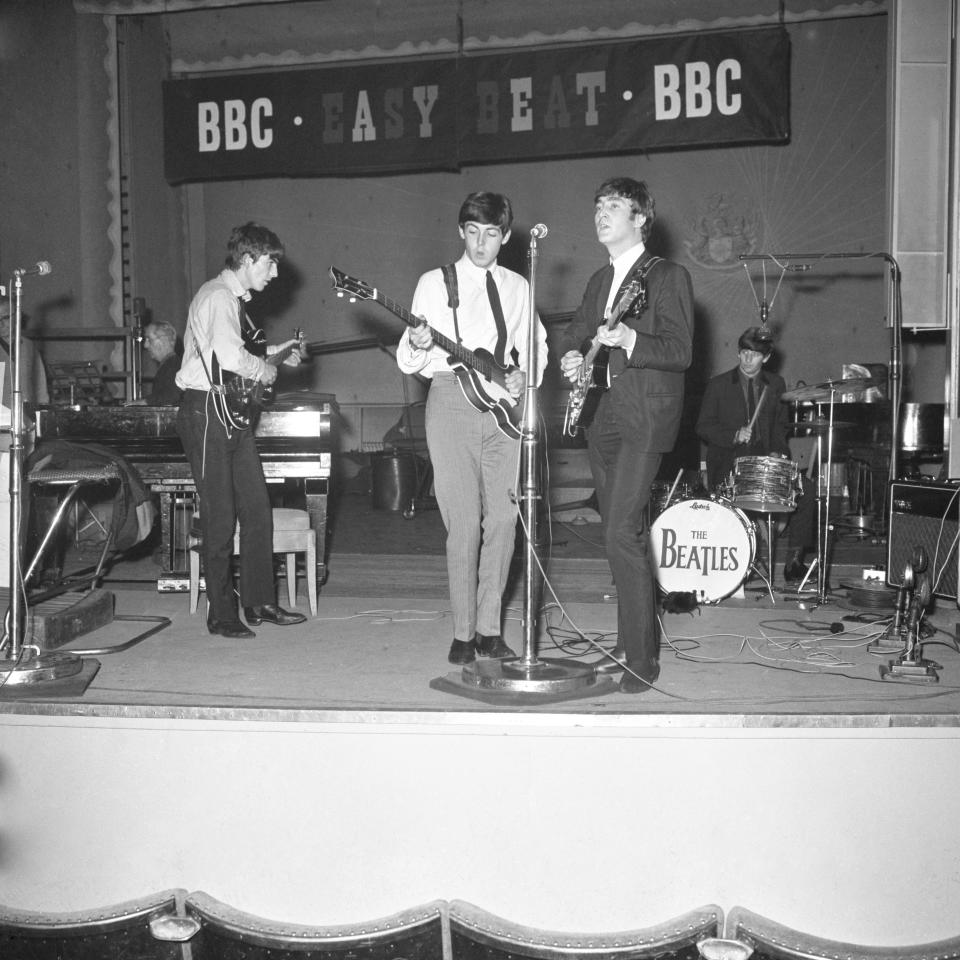 The Beatles singing together during a recording session for the BBC radio programme 'Easy Beat'  CELEBRITY