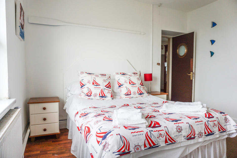 The bedroom has a nautical theme. (Purple Bricks)