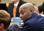 FILE - In this July, 9, 2018, file photo, plaintiff DeWayne Johnson looks up during a brief break as the Monsanto trial continues in San Francisco. Monsanto is being accused of hiding the dangers of its popular Roundup products. A San Francisco jury on Friday, Aug. 10, 2018, ordered agribusiness giant Monsanto to pay $289 million to a former school groundskeeper dying of cancer, saying the company's popular Roundup weed killer contributed to his disease. (Josh Edelson/Pool Photo via AP, File)