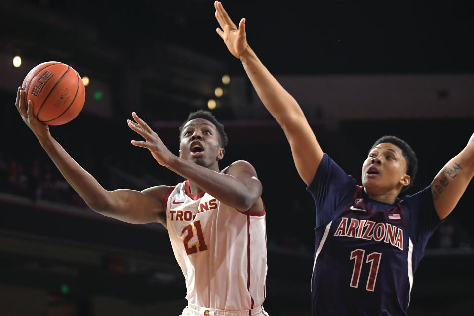 FILE - In this Thursday, Feb. 27, 2020, file photo, Southern California forward Onyeka Okongwu, left, shoots as Arizona forward Ira Lee defends during the first half of an NCAA college basketball game in Los Angeles. Okongwu is a considered a potential lottery pick in the NBA draft, on Wednesday, Nov. 18, 2020. (AP Photo/Mark J. Terrill, File)