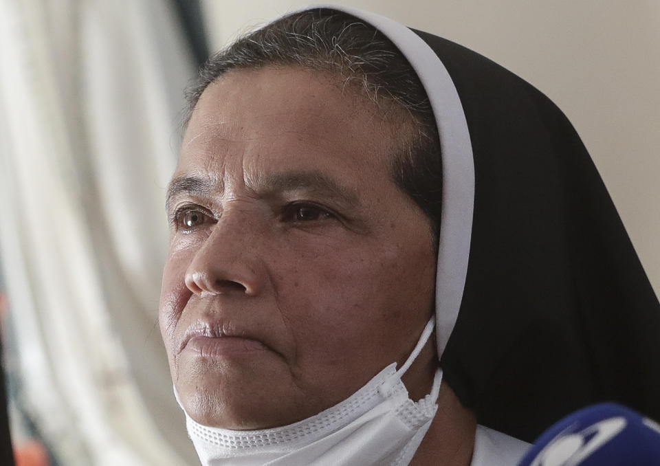 FILE — Colombian nun Gloria Cecilia Narvaez, who was held captive for nearly five years by al-Qaida-linked militants, listens to a question during a press conference in Bogota, Colombia, in this Friday, Nov. 19, 2021 file photo. Pope Francis authorized spending up to 1 million euro to free Narvaez, Cardinal Angelo Becciu testified at the Vatican's big financial fraud trial Thursday, May 5, 2022, revealing previously top secret negotiations that Francis authorized to hire a British security and intelligence firm to find the nun and pay for her liberation. (AP Photo/Ivan Valencia)