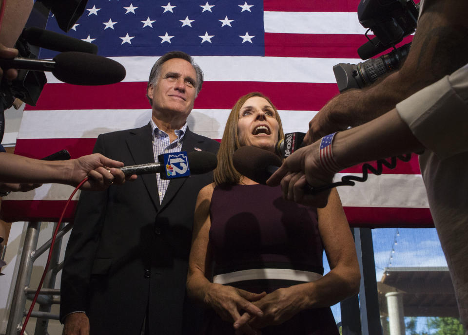 McSally, accompanied by former Republican presidential nominee Mitt Romney, answers questions during a rally on Oct. 12, 2018, in Gilbert, Ariz. (Photo: Darryl Webb/AP)