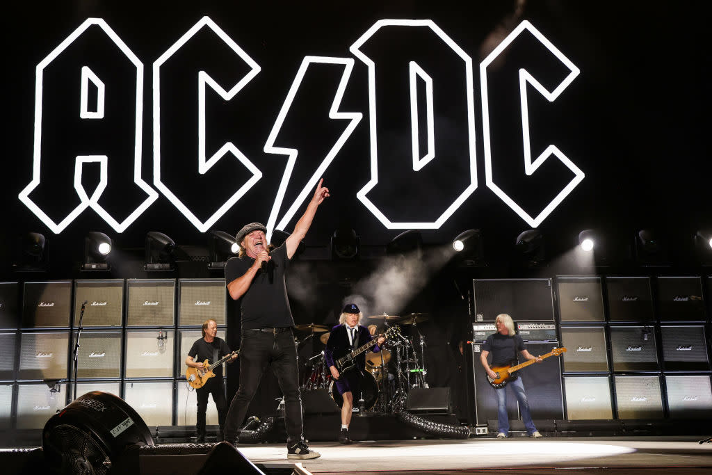  Stevie Young, Brian Johnson, Angus Young, and Cliff Williams of AC/DC perform onstage during the Power Trip music festival at Empire Polo Club on October 07, 2023 in Indio, California. (Photo by Kevin Mazur/Getty Images for Power Trip). 