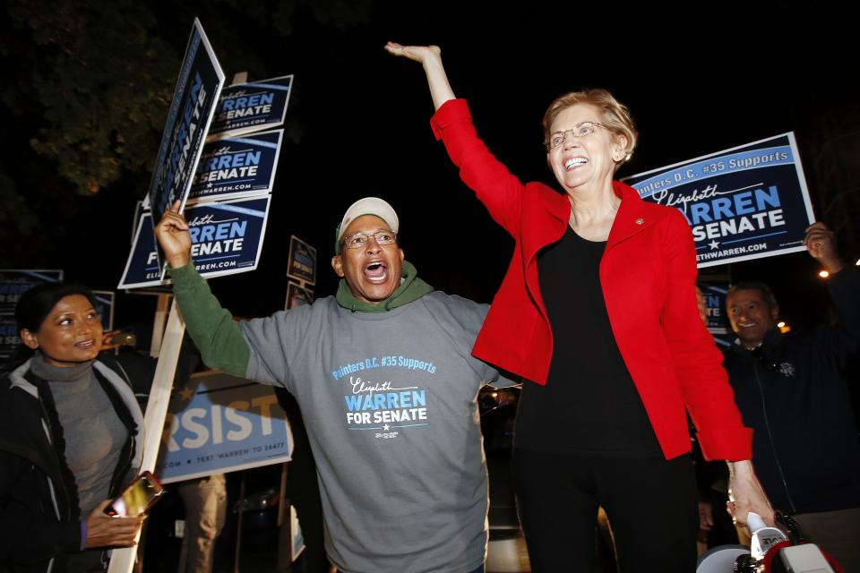 Sen. Elizabeth Warren greets supporters before a debate against her Republican opponent Geoff Diehl in Boston, Friday, Oct. 19, 2018. (AP Photo/Michael Dwyer)