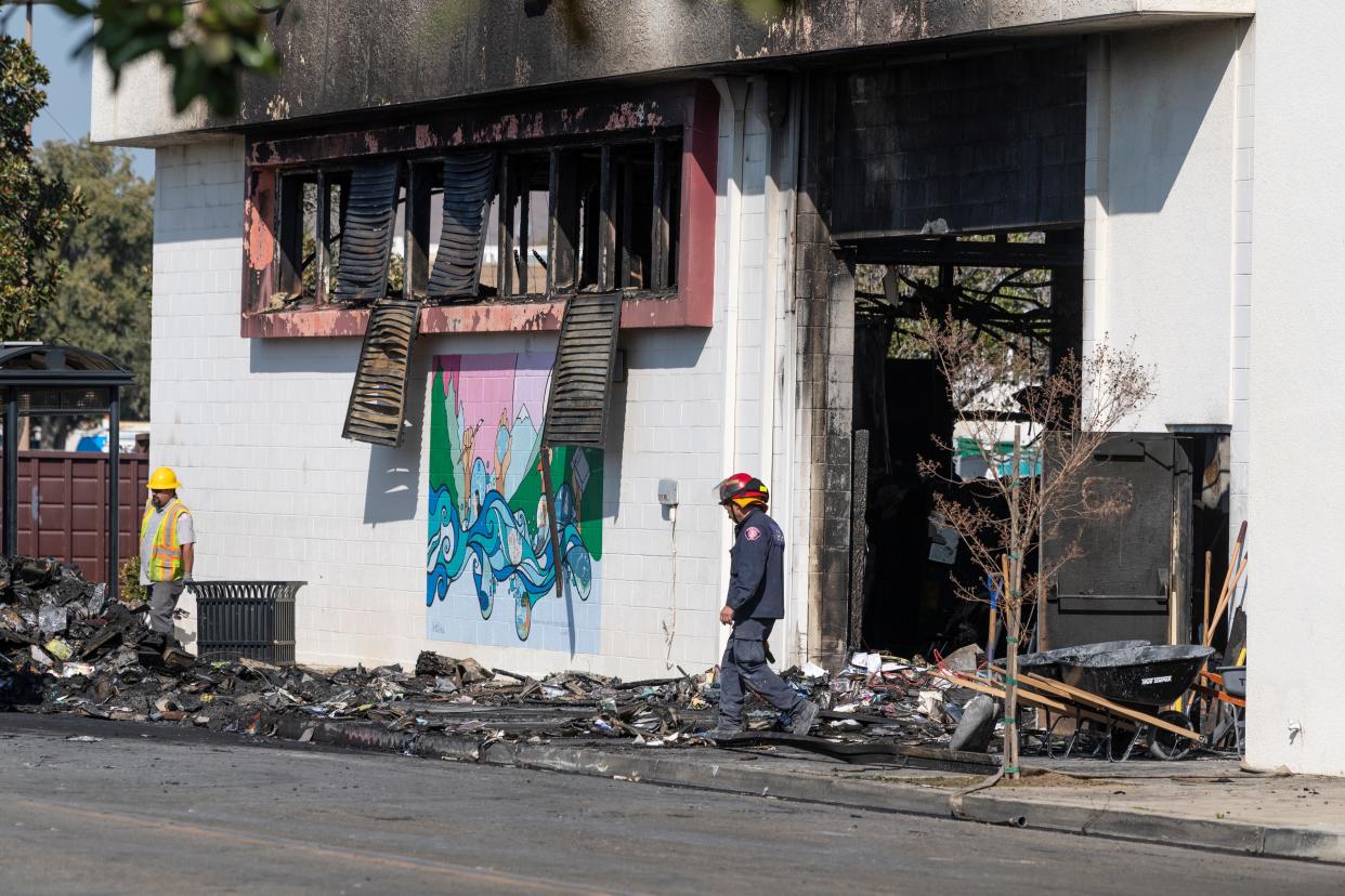 California fire crews from Visalia, Tulare and other agencies remove debris from the Porterville City Library on Febr. 20. Two firefighters were killed when the building went up in flames.