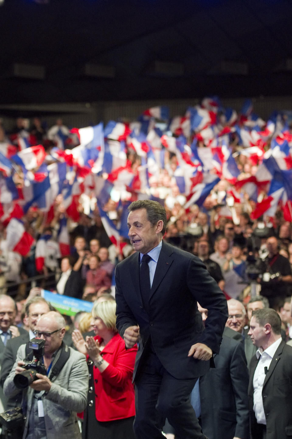 French incumbent President and Union for a Popular Movement (UMP) candidate for the French 2012 presidential elections Nicolas Sarkozy arrives on stage to give a speech during a campaign meeting in Nancy, eastern France, Monday, April 2, 2012. (AP Photo/Lionel Bonaventure, Pool)