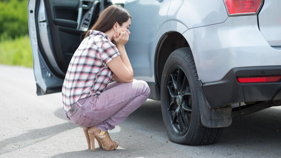 woman with flat tire