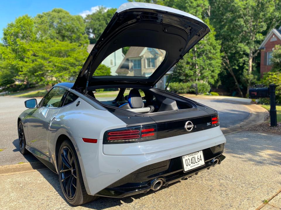 A 2024 Nissan Z sports car with its rear hatch open.