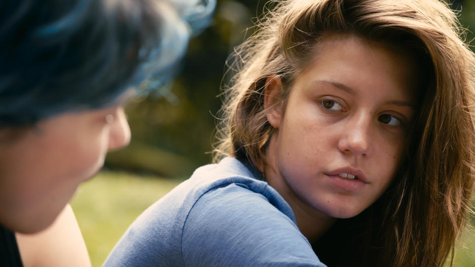 FILE - This photo released by courtesy of Sundance Selects shows Lea Seydoux, left, as Emma and Adele Exarchopoulos as Adele in the film, "Blue Is the Warmest Color," directed by Abdellatif Kechiche. The film was nominated for a Golden Globe for best foreign language film. The 71st annual Golden Globes will air on Sunday, Jan. 12, 2014. (AP Photo/Courtesy Sundance Selects, File)