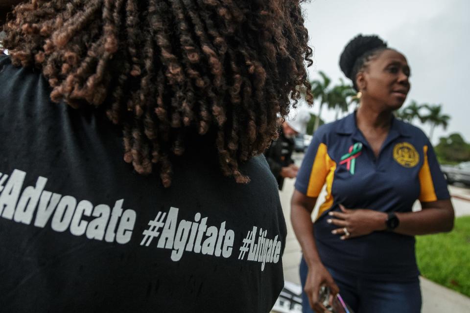 Supporters of the Coalition for Black Student Achievement gather to protest new state education standards on teaching slavery.