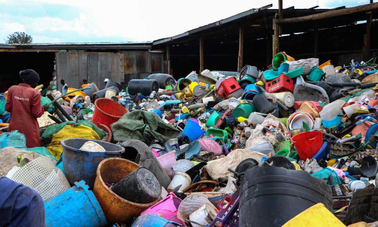 <span>Kenyan workers collect plastic waste for recycling in Nakuru.</span><span>Photograph: Anadolu/Getty Images</span>