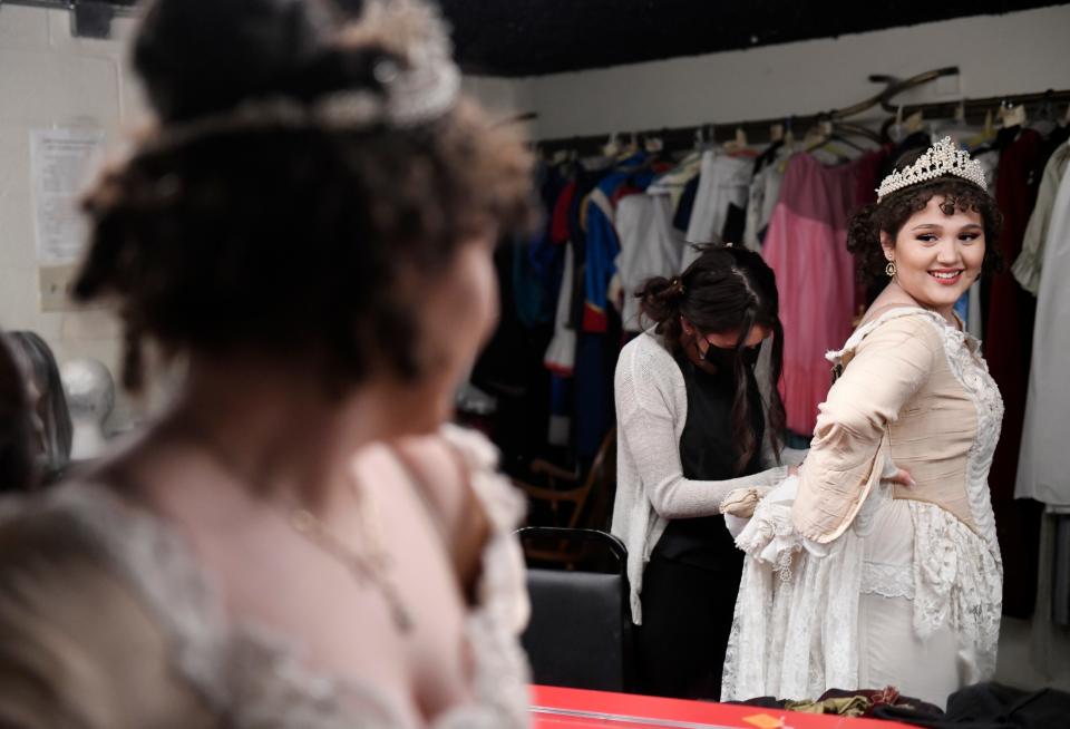 Eliot Ruiz looks in the mirror while being helped into her costume before "A Christmas Carol" rehearsal, Tuesday, Nov. 17, 2020, at Harbor Playhouse. Ruiz played the Ghost of Christmas Past.