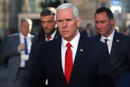 U.S. Vice President Mike Pence walks outside Hotel Bayerischer Hof during Munich Security Conference in Munich, Germany February 16, 2019. REUTERS/Michael Dalder