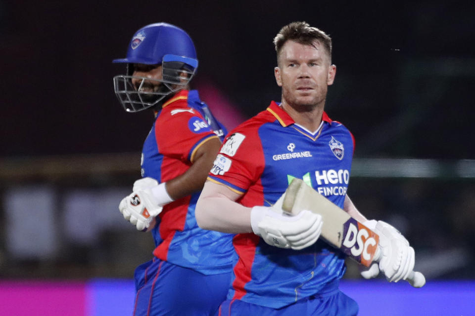 Delhi Capitals' David Warner, right, and captain Rishabh Pant run between the wickets during the Indian Premier League cricket match between Delhi Capitals and Rajasthan Royals in Jaipur, India, Thursday, March 28, 2024. (AP Photo/Pankaj Nangia)