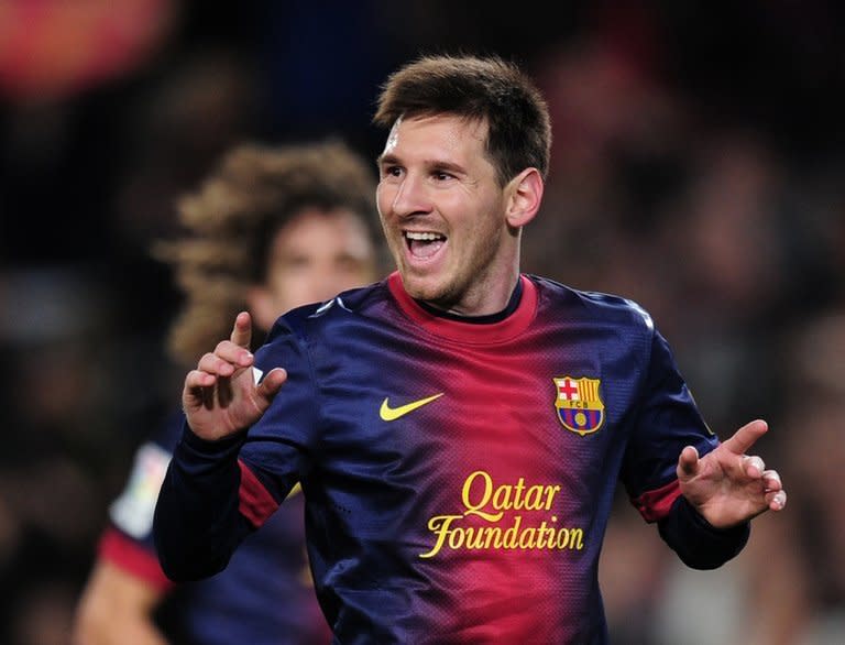 Barcelona forward Lionel Messi celebrates after scoring during a La Liga match against Espanyol on January 6, 2013. Messi is poised to become the first player to win four successive Ballon d'Or awards on Monday, sealing his status as the greatest player of his generation