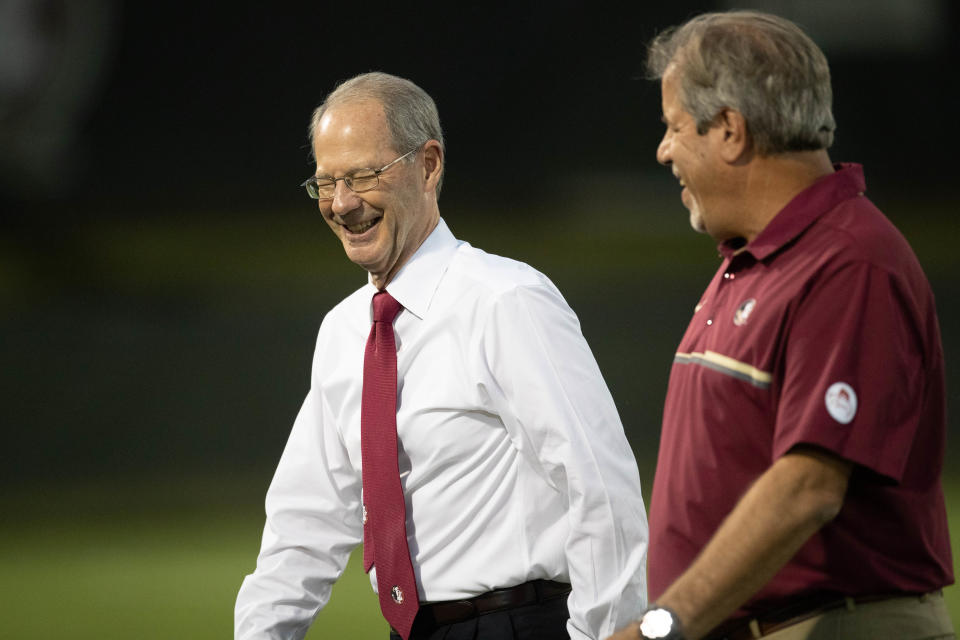 Florida State University Athletic Director David Coburn and Head Soccer Coach Mark Krikorian laugh during a game between FSU and the University of Virginia at the Seminole Soccer Complex Thursday, Oct. 28, 2021.