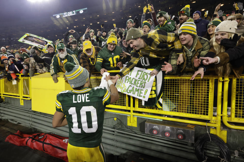 Green Bay Packers quarterback Jordan Love celebrates with fans following an NFL football game against the Chicago Bears Sunday, Jan. 7, 2024, in Green Bay, Wis. The Packers won 17-9. (AP Photo/Mike Roemer)