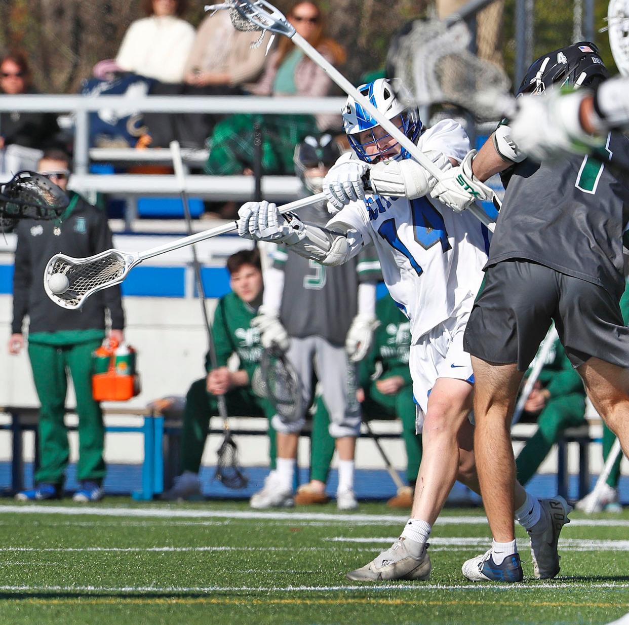 Scituate #14 Willy Robinson gets of a sidearm shot for a score.Scituate hosts Duxbury in boys lacrosse on Monday May 6, 2022   