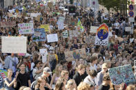 People take part in the Global Climate Strike protest 'Fridays For Future' in Berlin, Germany, Friday, Sept. 15, 2023. Tens of thousands of climate activists around the world are set to march, chant and protest Friday to call for an end to the burning of planet-warming fossil fuels as the globe continues to suffer dramatic weather extremes and topple heat records. (AP Photo/Markus Schreiber)
