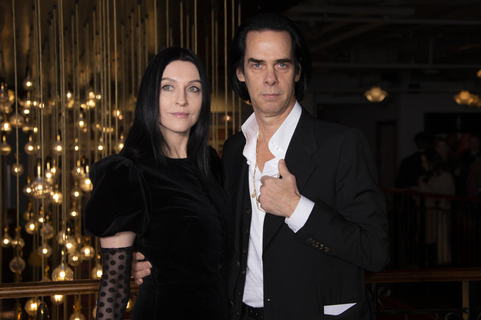 Musician Nick Cave, right, and fashion designer wife Susie Bick pose for photographers during a UK charity premiere for the film 'True History of the Kelly Gang' at a central London cinema, Monday, Feb. 17, 2020. (Photo by Joel C Ryan/Invision/AP)