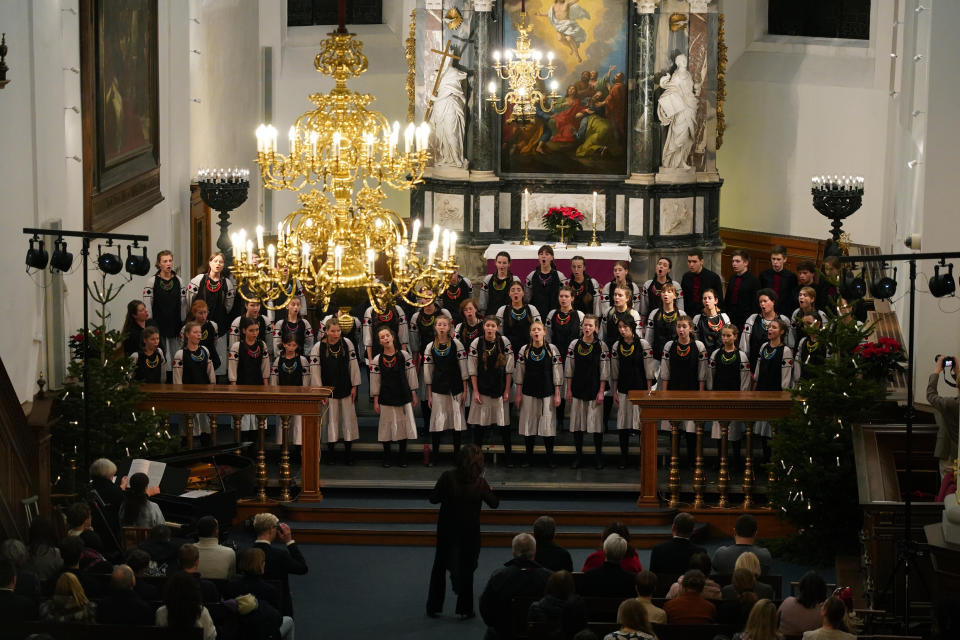 The Shchedryk youth choir performs a Christmas concert at Copenhagen’s Church of the Holy Spirit, in Copenhagen, Denmark, Thursday, Dec. 8 2022. The Shchedryk ensemble, described as Kyiv’s oldest professional children’s choir, were in the Danish capital this week for a performance as part of an international tour that also took them to New York’s famed Carnegie Hall. (AP Photo/James Brooks)