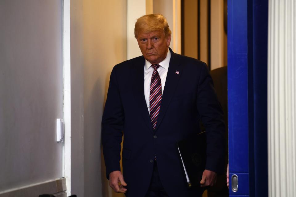 US President Donald Trump arrives to speak in the Brady Briefing Room at the White House in Washington, DC on November 5, 2020. - Democrat Joe Biden is leading President Donald Trump in the race for the 270 electoral votes that will put one of them over the top, with the Democrat's campaign asserting they believe he has enough votes to win in key battleground states that remain undecided, like Pennsylvania. (Photo by Brendan Smialowski / AFP) (Photo by BRENDAN SMIALOWSKI/AFP via Getty Images)