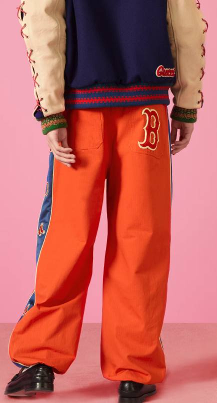 Orange joggers with Red Soxs logo along sides and back pocket