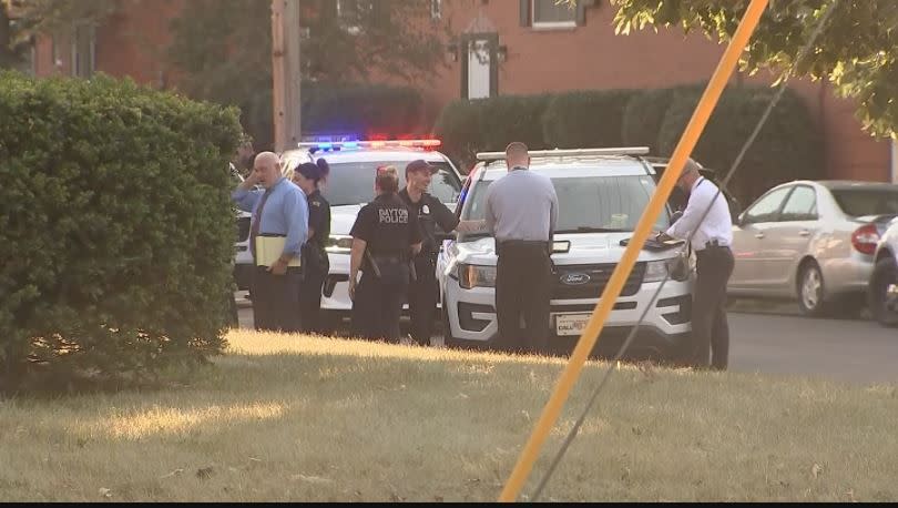 Dayton police investigate a shooting that left a man dead and sent four others to area hospitals Sunday on Superior Avenue. (Nate Russell/Staff)