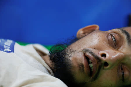 A man who was brought with some injuries and suffering from severe diarrhoea recovers at a dysentery clinic run by Medical Teams International in Kutupalong camp near Cox's Bazar, Bangladesh October 6, 2017. REUTERS/Damir Sagolj