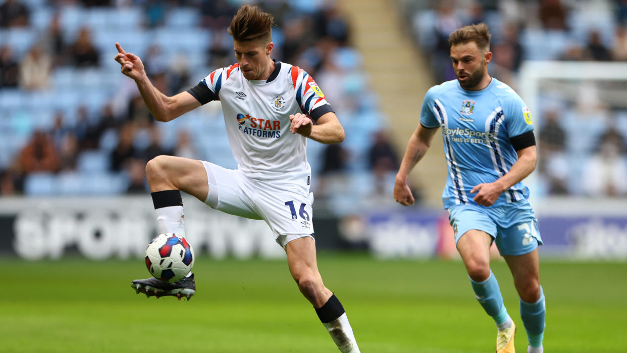  Matty Godden of Coventry City chases down by Reece Burke of Luton Town 