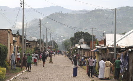 Residents gather outside their houses in the Nyakabiga neighbourhood of Burundi's capital Bujumbura, December 12, 2015. REUTERS/Jean Pierre Aime Harerimana