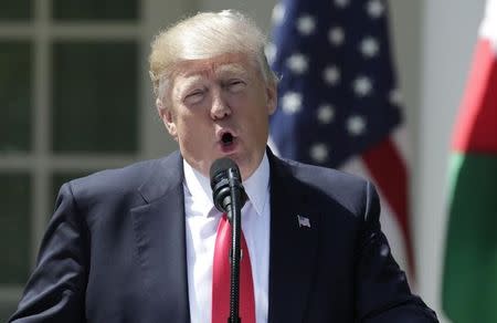 FILE PHOTO: U.S. President Donald Trump speaks about the gas attack in Syria during a joint news conference with Jordan's King Abdullah II in the Rose Garden at the White House in Washington, U.S., April 5, 2017. REUTERS/Yuri Gripas