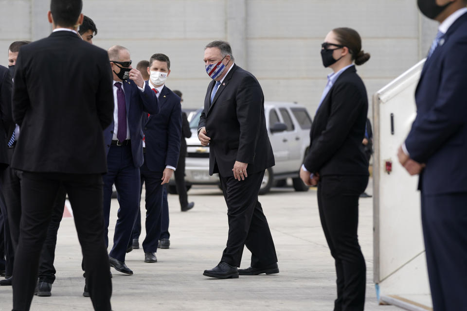 U.S. Secretary of State Mike Pompeo prepares to board a plane at Ben Gurion Airport in Tel Aviv, Friday, Nov. 20, 2020. Pompeo is en route to the United Arab Emirates. (AP Photo/Patrick Semansky, Pool)