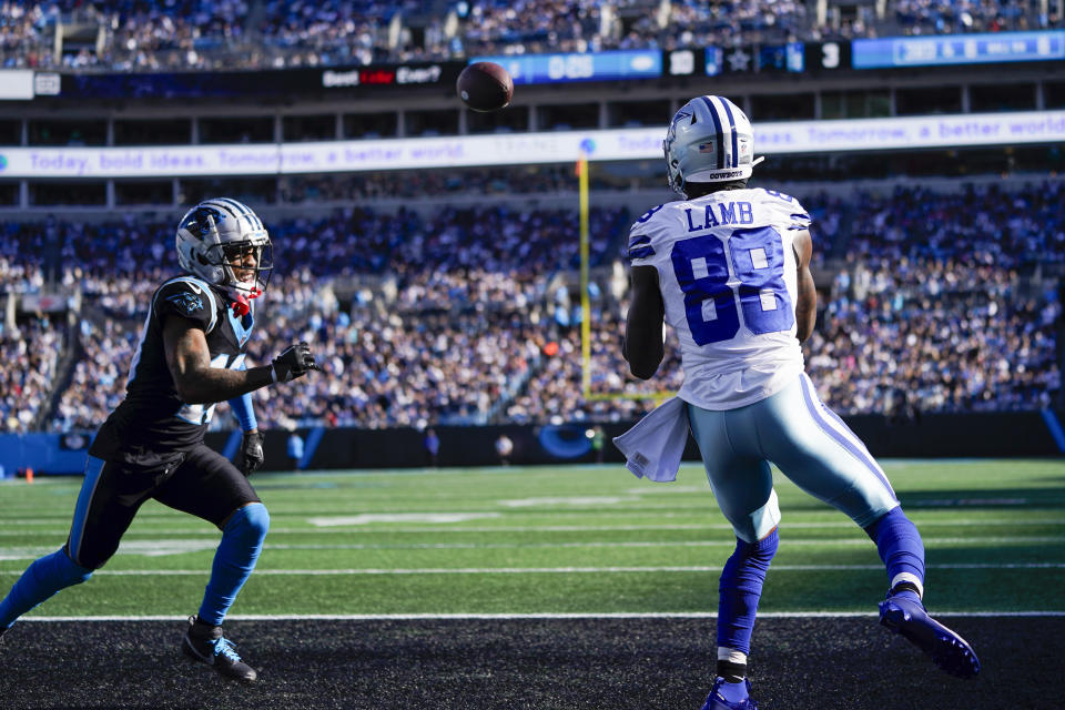 Dallas Cowboys wide receiver CeeDee Lamb (88) catches a touchdown pass against the Carolina Panthers during the first half of an NFL football game Sunday, Nov. 19, 2023, in Charlotte, N.C. (AP Photo/Erik Verduzco)